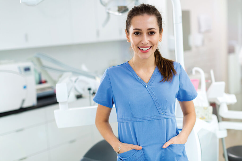 Female dentist in scrubs